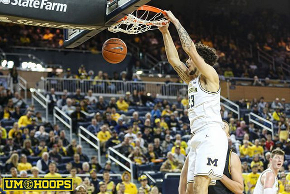 Brandon Johns Jr. (23) and Jon Teske (15)