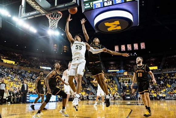 Eli Brooks (55) and Jon Teske (15)