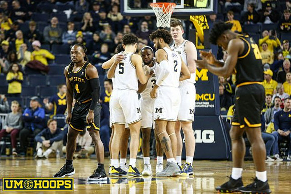 Adrien Nunez (5), Zavier Simpson (3), Isaiah Livers (2), and Jon Teske (15)