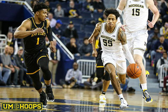 Eli Brooks (55) and Jon Teske (15)
