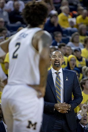 Isaiah Livers (2) and Juwan Howard
