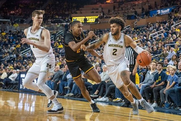 Colin Castleton (11) and Isaiah Livers (2)