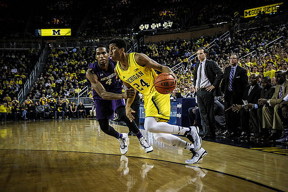 Aubrey Dawkins (24) and Northwestern Head Coach Chris Collins