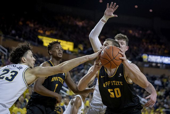 Brandon Johns Jr. (23) and Jon Teske (15)
