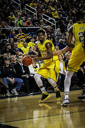 Derrick Walton Jr. (10) and Zak Irvin (21)
