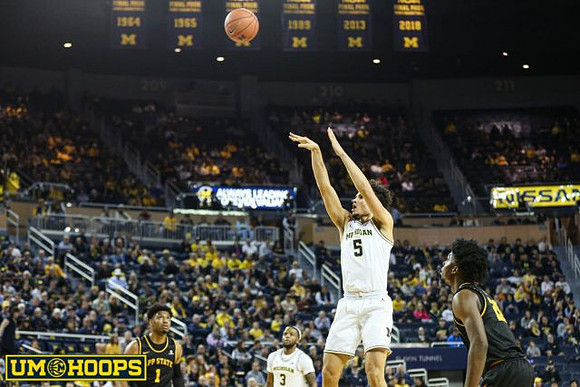Adrien Nunez (5) and Zavier Simpson (3)