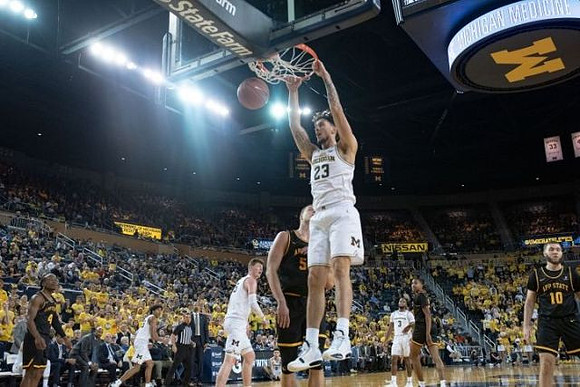 Eli Brooks (55), Jon Teske (15), Brandon Johns Jr. (23), and Zavier Simpson (3)
