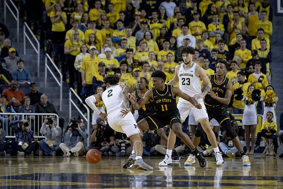 Isaiah Livers (2) and Brandon Johns Jr. (23)