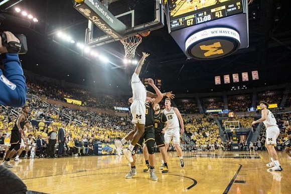 Jon Teske (15) and Brandon Johns Jr. (23)