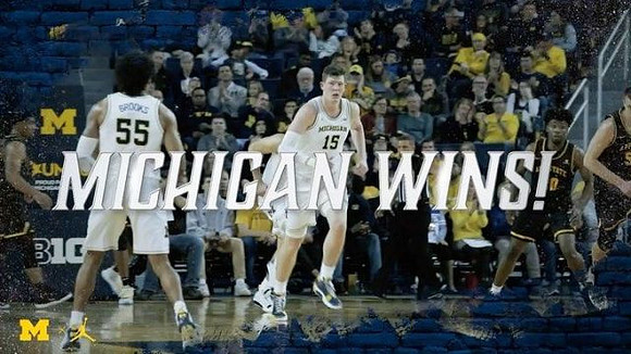 Eli Brooks (55) and Jon Teske (15)