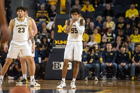 Brandon Johns Jr. (23) and Eli Brooks (55)