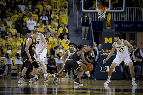 Jon Teske (15), David DeJulius (0), and Brandon Johns Jr. (23)