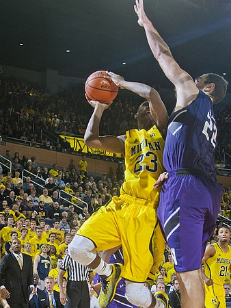 Caris LeVert (23), Zak Irvin (21), LaVall Jordan, and Jeff Meyer