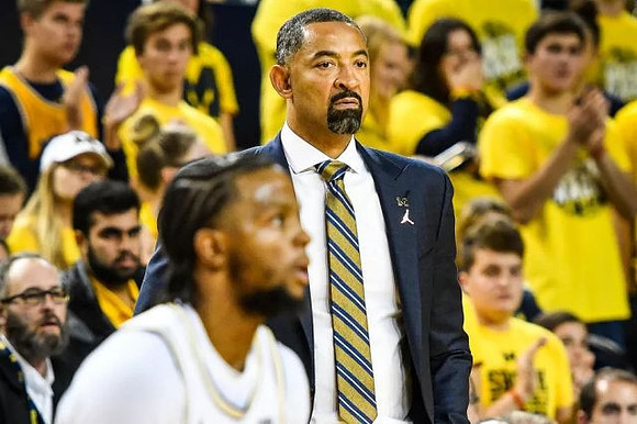 Zavier Simpson (3) and Juwan Howard