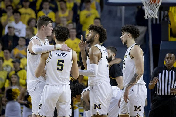 Jon Teske (15), Adrien Nunez (5), Isaiah Livers (2), Brandon Johns Jr. (23), and Eli Brooks (55)