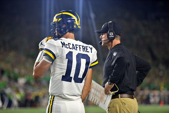 Dylan McCaffrey (10) and Jim Harbaugh