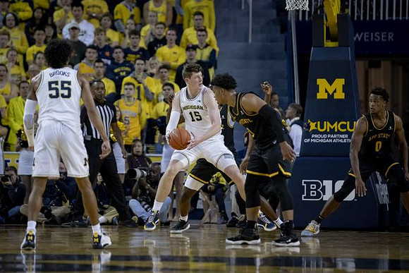 Eli Brooks (55) and Jon Teske (15)