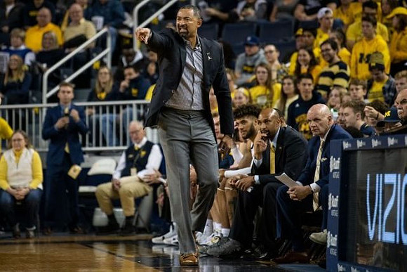 Juwan Howard, Isaiah Livers (2), Saddi Washington, and Phil Martelli