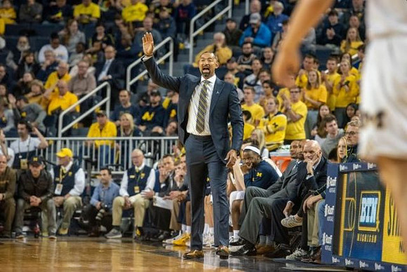 Juwan Howard, Zavier Simpson (3), Saddi Washington, and Phil Martelli
