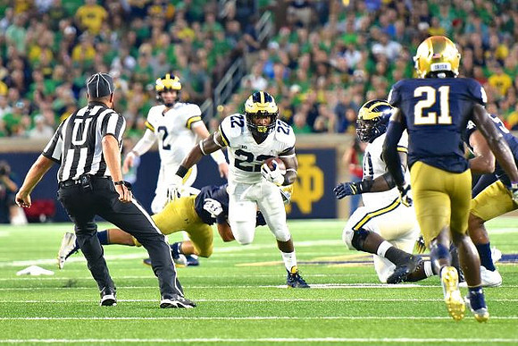 Shea Patterson (2) and Karan Higdon (22)