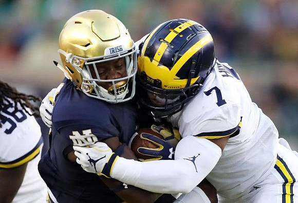 Devin Bush (10) and Devin Gil (36)