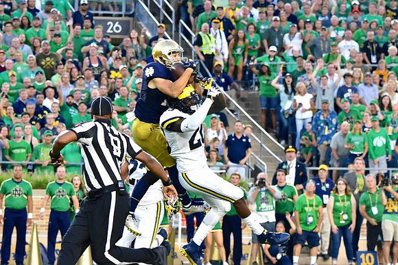 Tyree Kinnel (23) and Brad Hawkins (20)