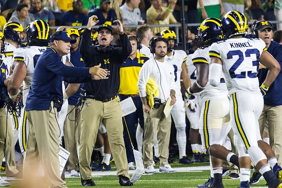 Don Brown, Jim Harbaugh, and Tyree Kinnel (23)