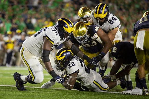 Juwann Bushell-Beatty (76), Karan Higdon (22), and Sean McKeon (84)