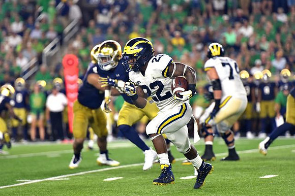 Karan Higdon (22) and Ben Bredeson (74)