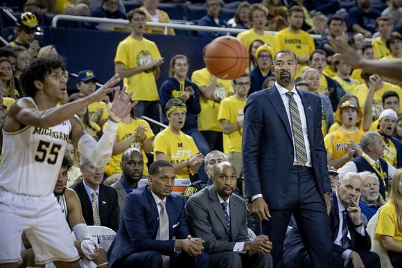 Eli Brooks (55), Howard Eisley, Saddi Washington, Juwan Howard, and Phil Martelli