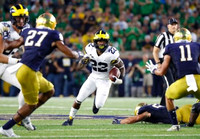 Zach Gentry (83) and Karan Higdon (22)