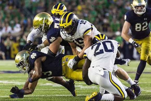 Chase Winovich (15) and Brad Hawkins (20)
