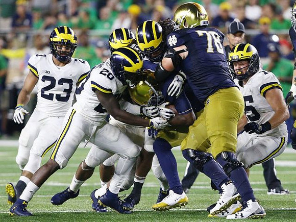 Tyree Kinnel (23), Brad Hawkins (20), and Chase Winovich (15)