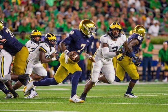 Josh Ross (12), Devin Bush (10), and Rashan Gary (3)