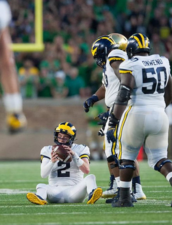 Shea Patterson (2), Juwann Bushell-Beatty (76), and Michael Onwenu (50)