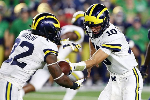 Karan Higdon (22) and Dylan McCaffrey (10)