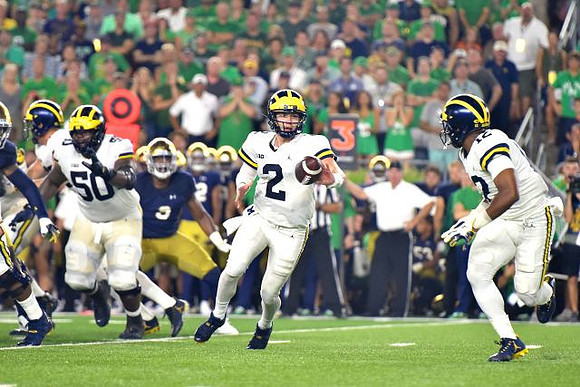 Michael Onwenu (50), Shea Patterson (2), and Chris Evans (12)
