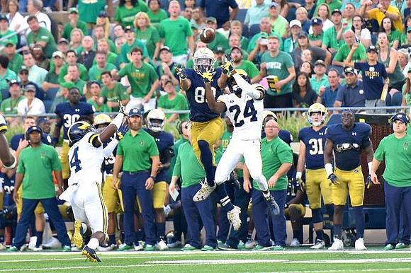 Josh Metellus (14) and Lavert Hill (24)