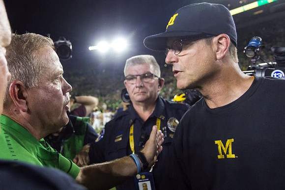 Notre Dame Head Coach Brian Kelly and Jim Harbaugh