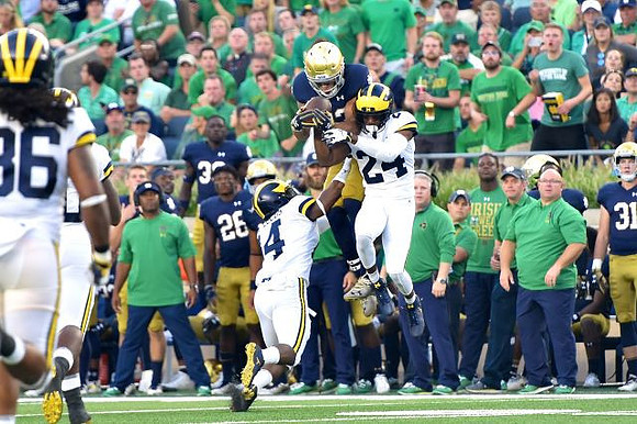 Devin Gil (36), Josh Metellus (14), and Lavert Hill (24)