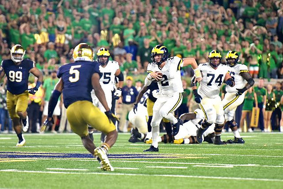 Jon Runyan Jr. (75), Shea Patterson (2), and Ben Bredeson (74)