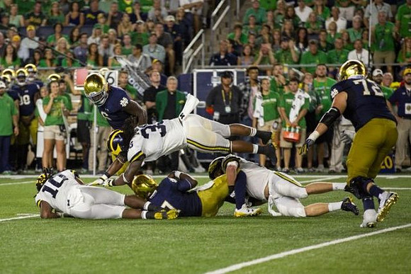 Devin Bush (10) and Devin Gil (36)