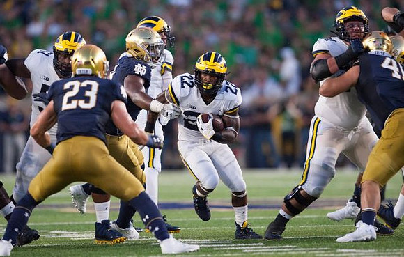 Cesar Ruiz (51) and Karan Higdon (22)
