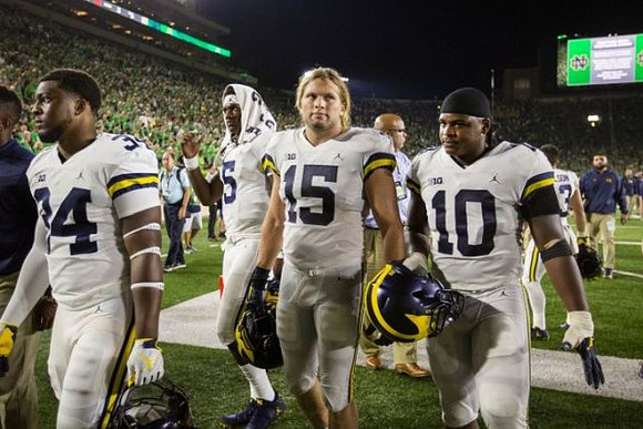 Jordan Anthony (34), Aubrey Solomon (5), Chase Winovich (15), and Devin Bush (10)