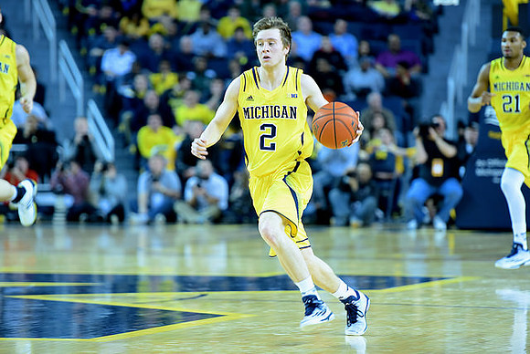 Spike Albrecht (2) and Zak Irvin (21)