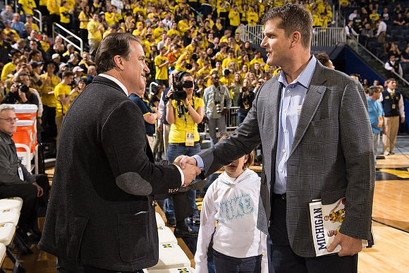 Steve Mariucci  and Jim Harbaugh