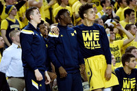 Duncan Robinson (22), Caris LeVert (23), D.J. Wilson (5), and Austin Hatch (30)
