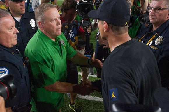 Notre Dame Head Coach Brian Kelly and Jim Harbaugh