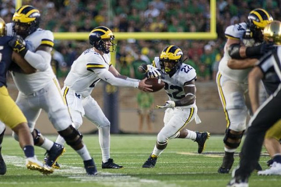 Shea Patterson (2) and Karan Higdon (22)
