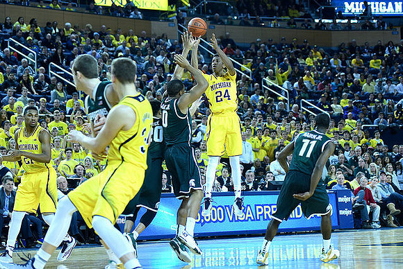 Zak Irvin (21), Mark Donnal (34), and Aubrey Dawkins (24)
